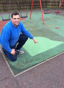 Alderman Stewart McDonald inspects recent patch work at Ahoghill Play Park